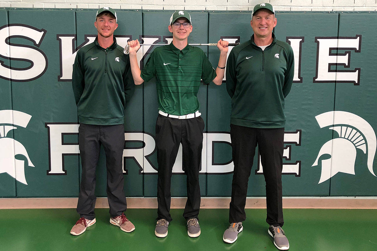 Skyline assistant coach Brian Mogg (left), Skyline senior Matthew Mogg (center) and Skyline head coach Gary Mogg (right) have an undeniable passion for the sport of golf. Photo courtesy of Gary Mogg