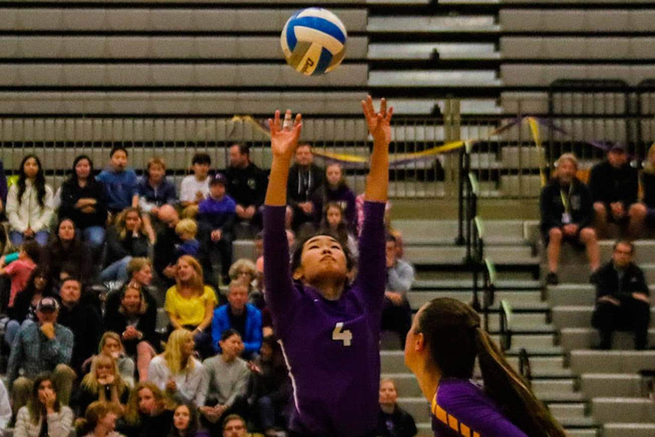 Issaquah Eagles senior setter Claire Hyun sets up a perfect pass to one of her teammates against the Woodinville Falcons on Oct. 17. Issaquah cruised to a 3-0 (25-10, 25-17, 25-13) victory on senior night. Photo courtesy of Don Borin/Stop Action Photography