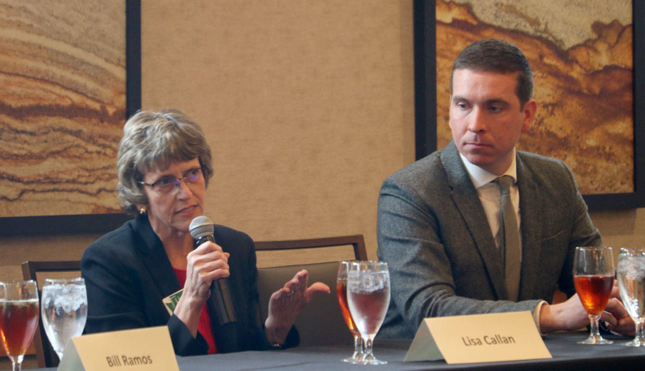 Lisa Callan and Paul Graves answer questions on education funding. Evan Pappas/Staff Photo