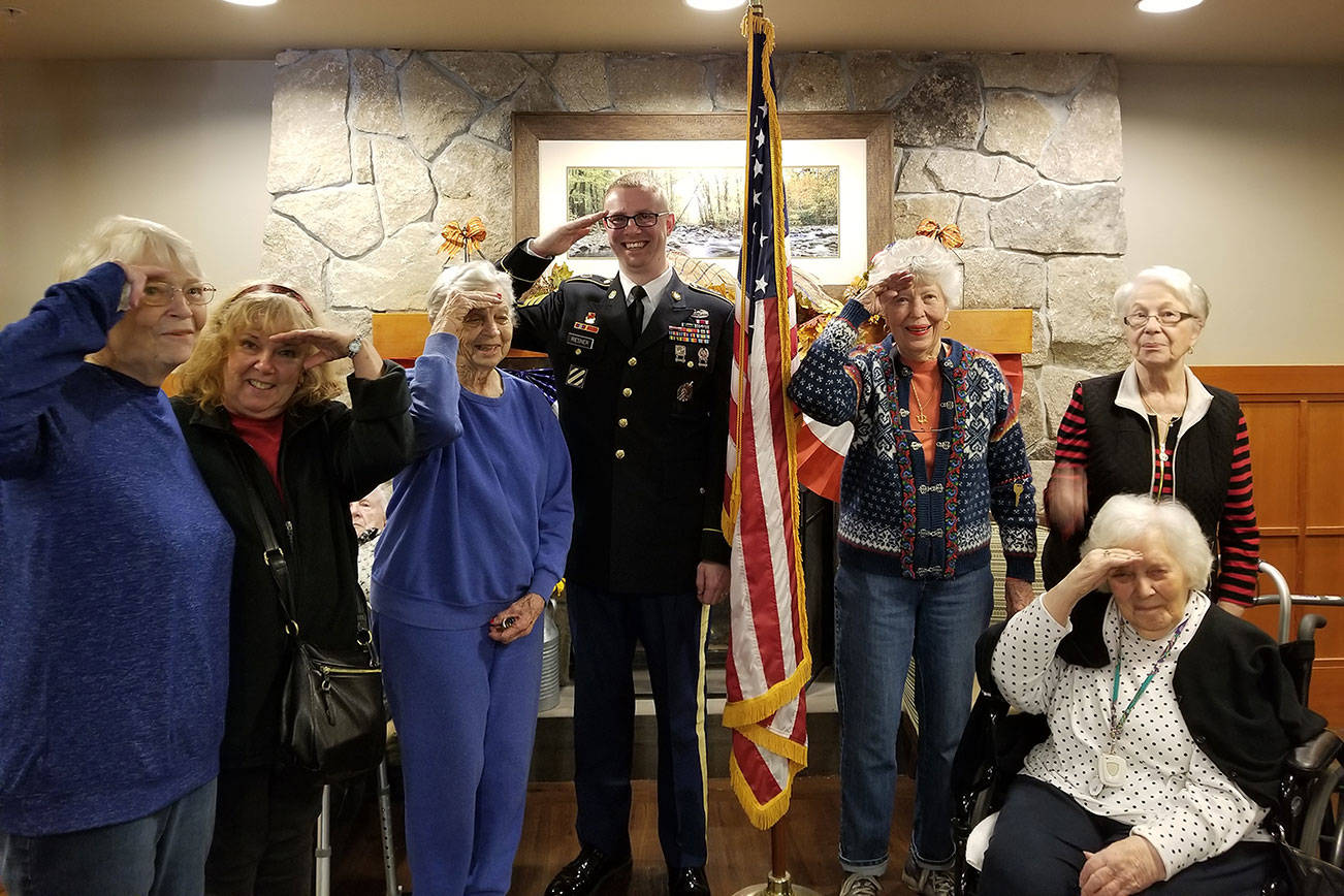 Sgt. 1st Class Trevor Riesner, an active service member, visits with Spiritwood residents during Veterans Day to answer questions and meet with other veterans. Photo courtesy of Jennifer Angell