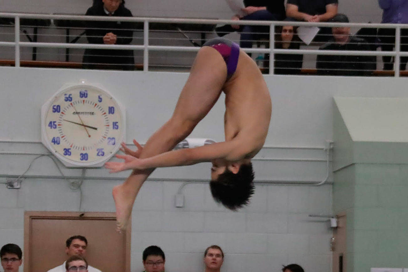 Issaquah Eagles freshman diver Robert Gref competes in the 1-meter dive event against the Liberty Patriots on Nov. 29. Gref is one of the best divers in Washington. Photo courtesy of Don Borin/Stop Action Photography