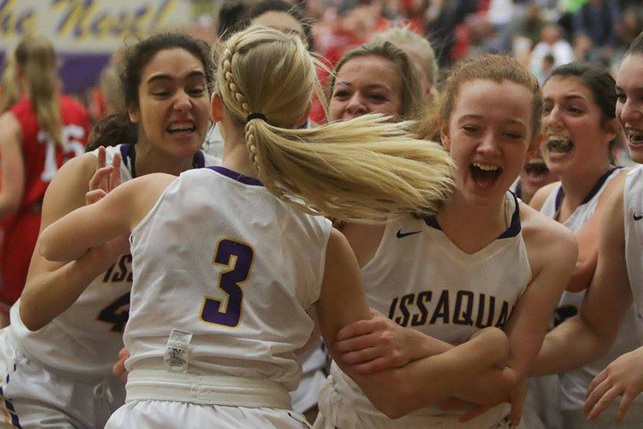 Issaquah Eagles players celebrate after Issaquah freshman Camryn Gibson (No. 3) recorded a game-winning basket at the buzzer against the Mount Si Wildcats. Issaquah defeated Mount Si,49-48, on Jan. 5. Photo courtesy of Don Borin/Stop Action Photography