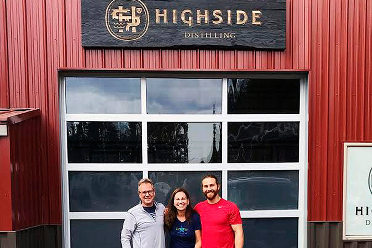 From left, Jeff, Helen and Matt Glenn pose before their opening day for Highside Distilling. Photo courtesy of Matt Glenn.