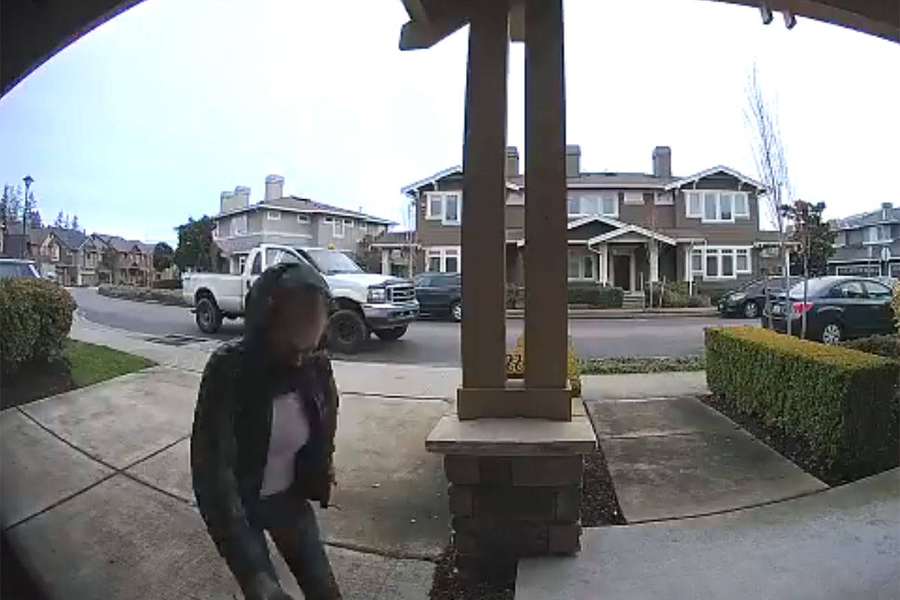 Porch pirates strike at an Issaquah Highlands home. Police arrested the two and personally returned numerous packages. Photos courtesy of the city of Issaquah