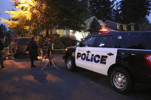 Authorities outside of the Klahanie home on Tuesday. Stephanie Quiroz/staff photo