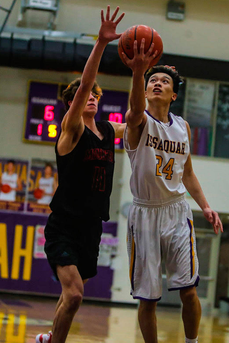 Issaquah Eagles senior Jonathan Lo (pictured) attacks the basket against the Mount Si Wildcats. Mount Si defeated Issaquah 74-49 on Jan. 25 at Issaquah High School. Photo courtesy of Don Borin/Stop Action Photography