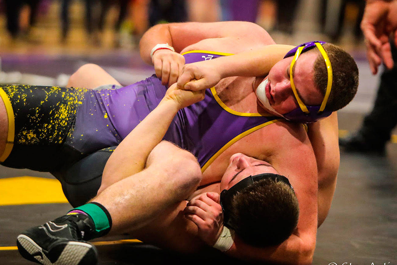 Issaquah Eagles grappler Mitchell Barnes pinned North Creek wrestler Daniel Shapovalov in the second round of the 4A KingCo 285-pound championship match. Barnes had an overall record of 4-0 at the tournament. Photo courtesy of Don Borin/Stop Action Photography