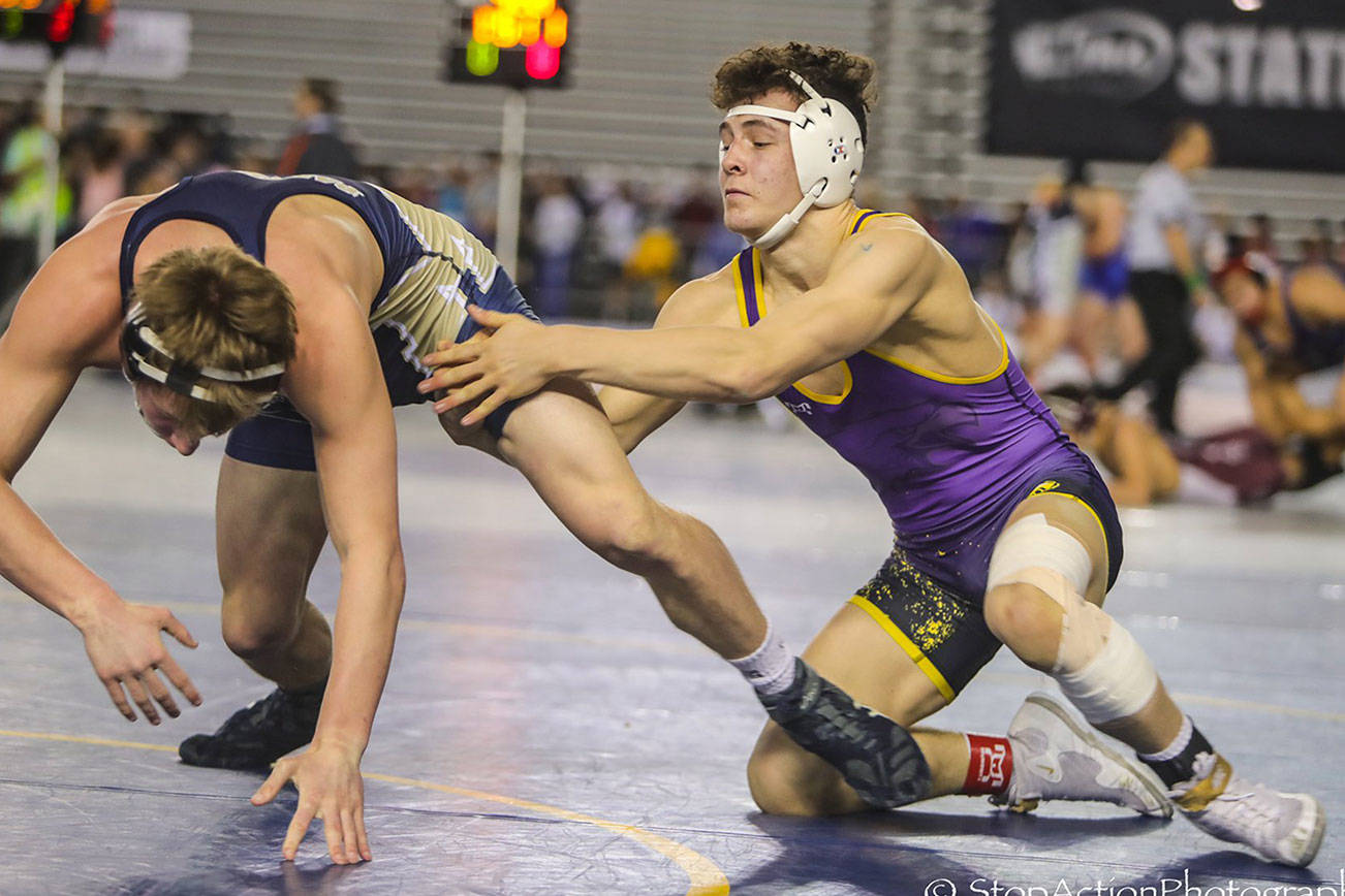 Issaquah Eagles 160-pound wrestler Cal Saper, right, captured three victories during the Mat Classic Class 4A state wrestling tournament on Feb. 15-16 at the Tacoma Dome. Photo courtesy of Don Borin/Stop Action Photography