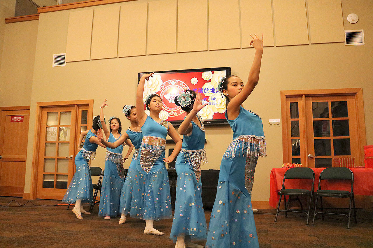 The Wahaga Youth Club preformed a traditional Chinese dance at Blakely Hall in Issaquah for the Chinese New Year celebration. Stephanie Quiroz/staff photo.