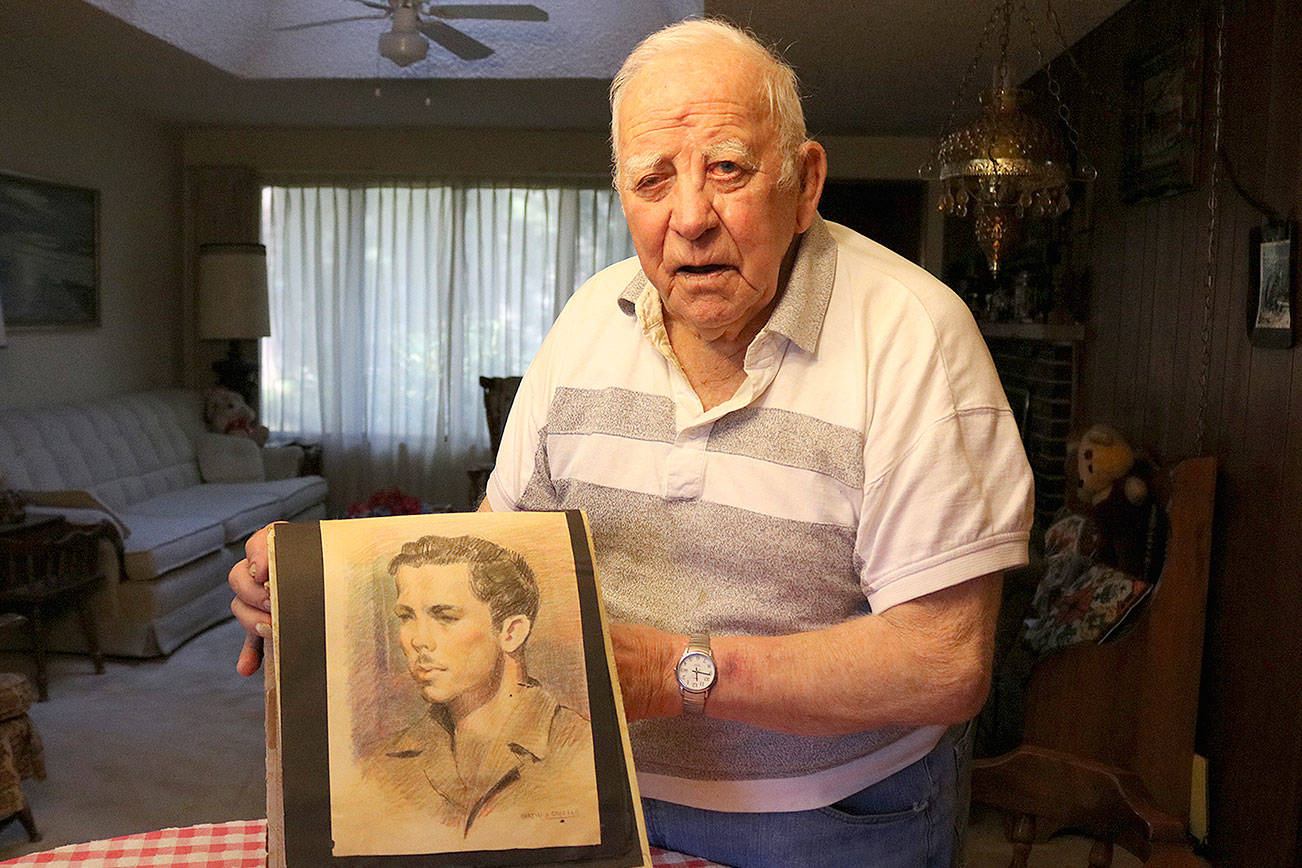 Stephanie Quiroz/staff photo                                 WWII veteran Dale Brown shows a drawing of himself when he was in Czechoslovakia circa 1945.
