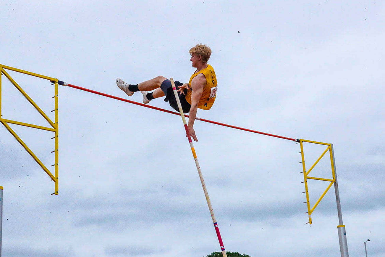 Issaquah junior Cooper Holy soars in the pole vault at the 4A state track meet. Holy finished in seventh place in his favorite event. Photo courtesy of Don Borin/Stop Action Photography
