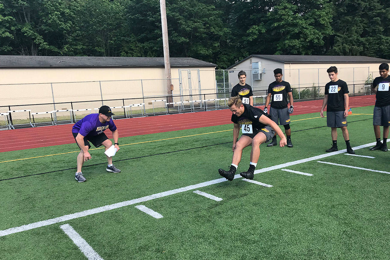 Issaquah Eagles football player Solomon Hawkins (No. 45) gives maximum effort in the broad jump on June 3 at Gary Moore Stadium in Issaquah. Shaun Scott/staff photo
