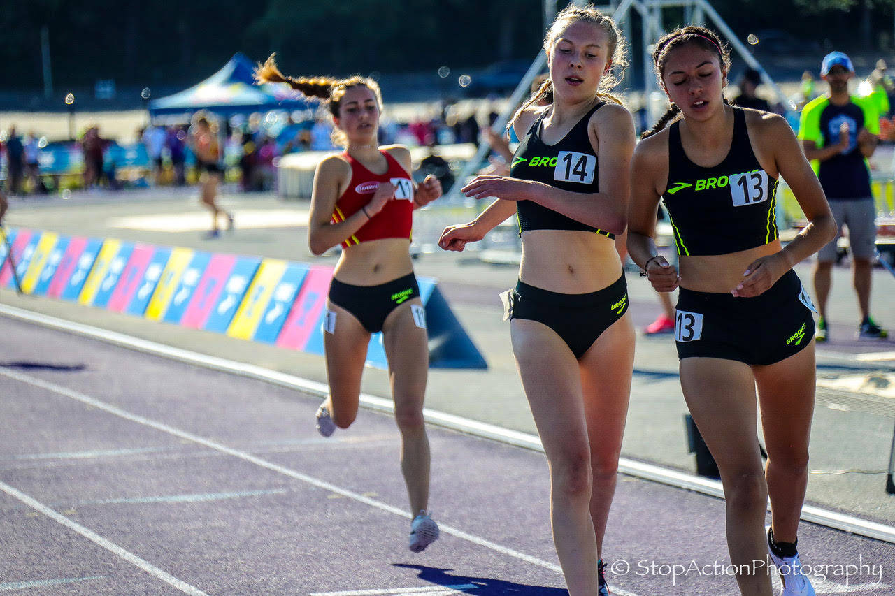 Issaquah Eagles track athlete Julia David-Smith, left, earned 14th place in the 1-mile run at the Brooks Invitational on June 15 at the University of Washington. Photo courtesy of Don Borin/Stop Action Photography