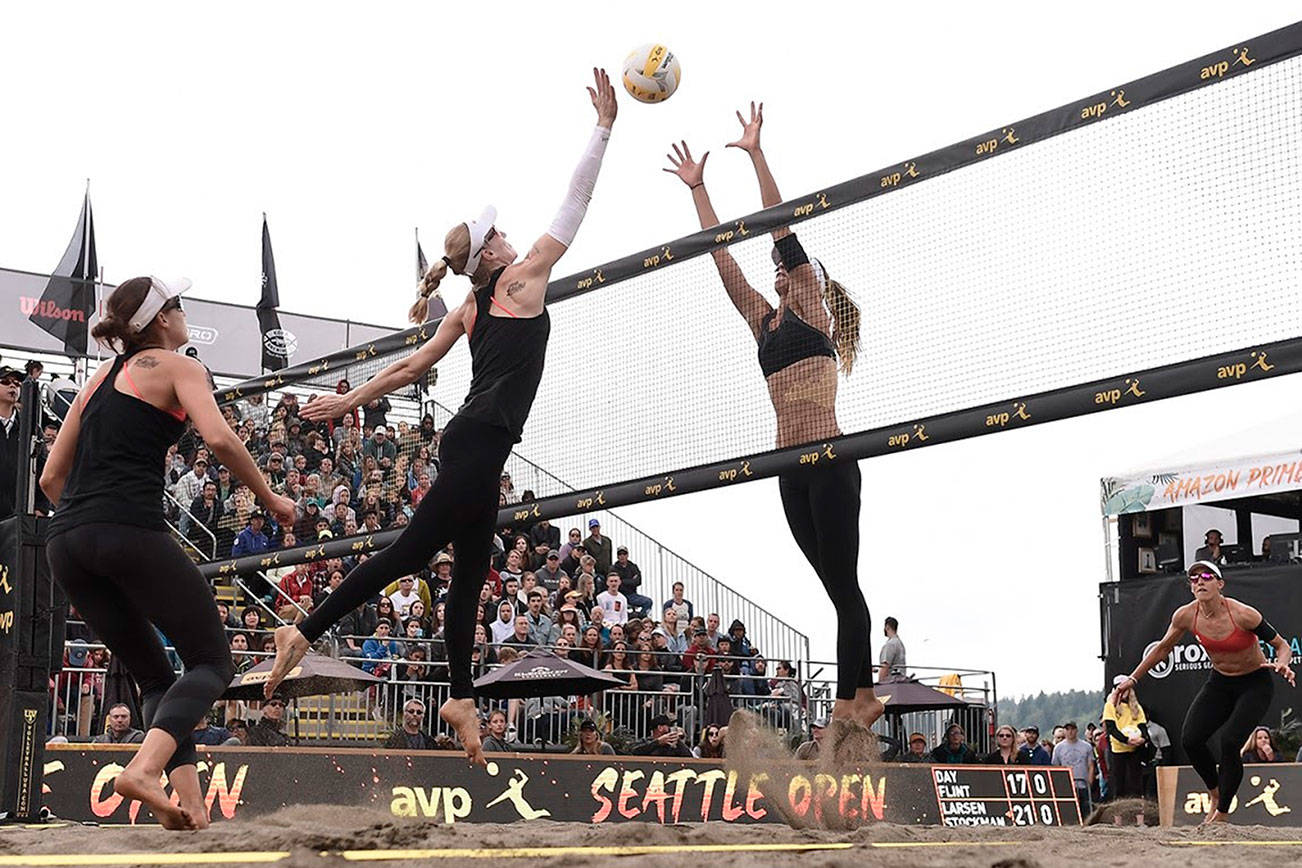 Emily Day, left, and Kelley Larsen, right, battle it out at the net during the women’s championship match at 2019 AVP Seattle Open on June 23 at Lake Sammamish State Park. Photo courtesy of Robert Beck