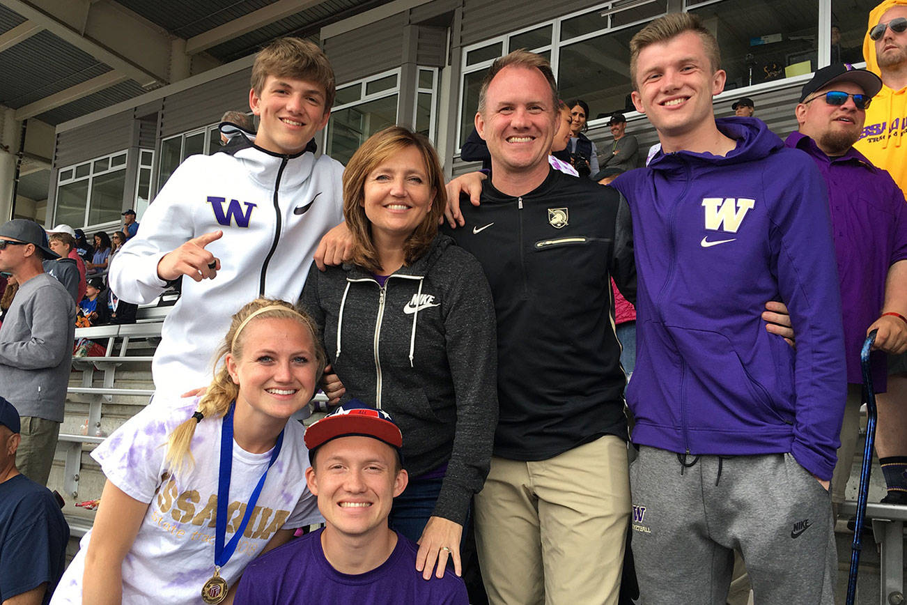 Doug Crandall (pictured in the black Nike sweatshirt) was hired as the new Issaquah Eagles girls basketball head coach in late May. Crandall is pictured with his wife Stephanie and children Timmy, Jason, John and Mackenzie while attending the state track meet at Mount Tahoma High School in late May. Photo courtesy of the Crandall family