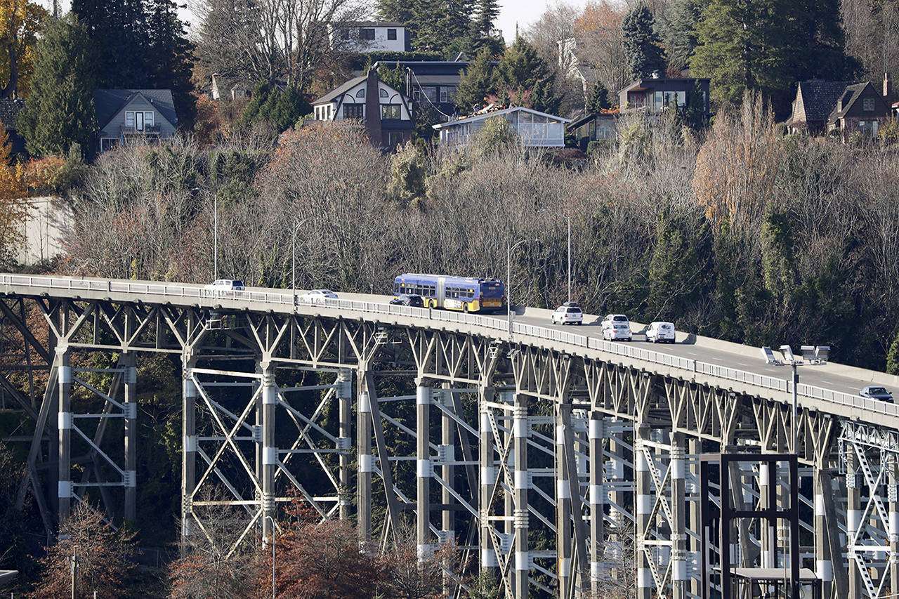 Traffic passes over the 90-year old Magnolia bridge, aging and in need of replacement, Wednesday in Seattle. State and local governments could end up scrambling to pay for road paving and other transportation projects as a Washington state measure that would cut car tabs to $30 was passing in early returns Tuesday. (AP Photo/Elaine Thompson)
