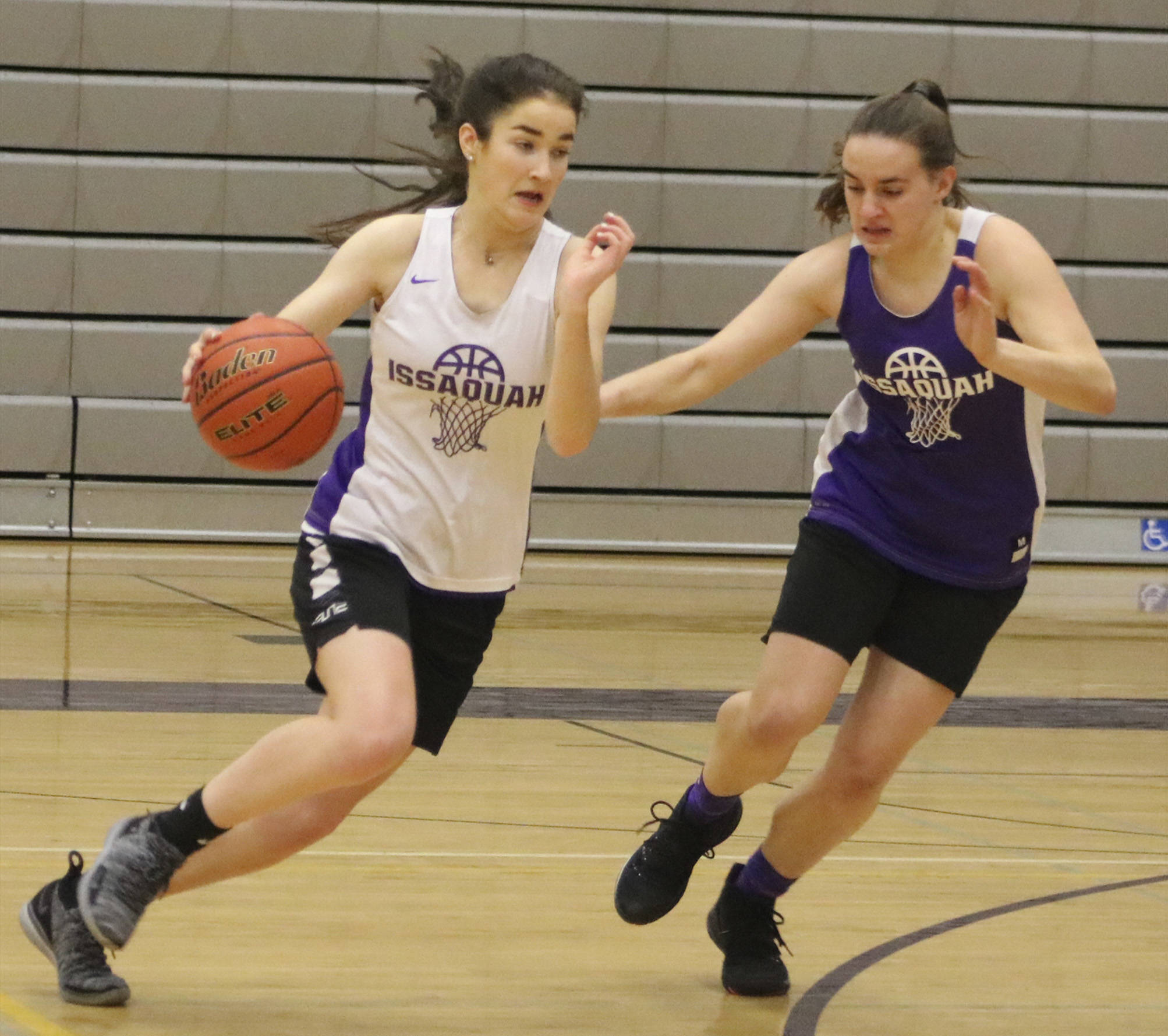 Issaquah forward Erin Schobbe (left) dribbles the ball during a scrimmage at practice on Dec. 2. Benjamin Olson/staff photo