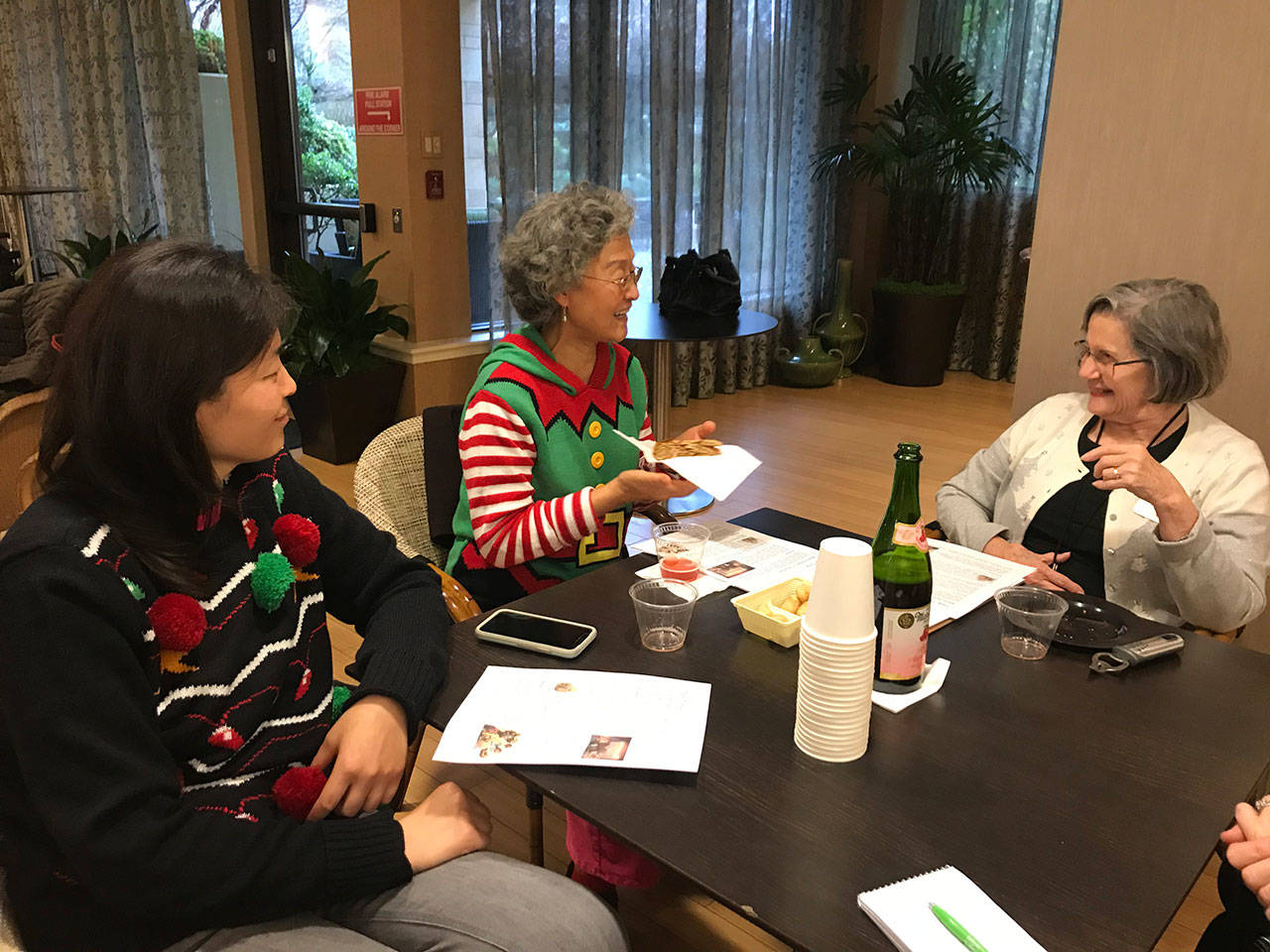 From left, Jenny Wang, Rose Fu and Nancy Irwin enjoy a conversation with each other during a Talk Time class at Aljoya Mercer Island. Samantha Pak/staff photo