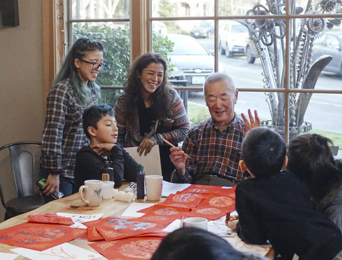 Allen Chen demonstrates the art of Chinese calligraphy at a workshop during the Issaquah Highlands Lunar New Year festivities. Courtesy photo by Jenny Peng.