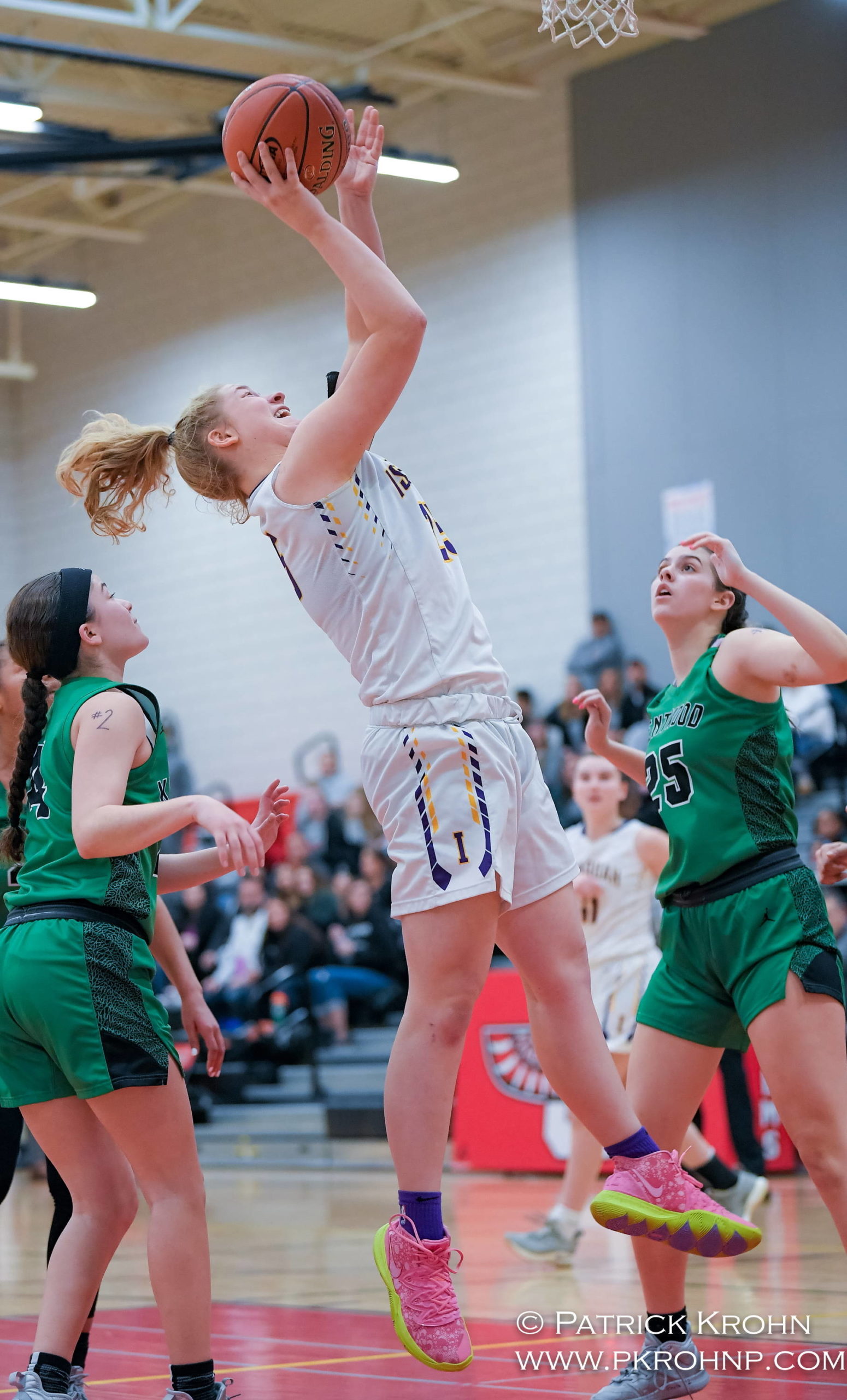 Issaquah sophomore Mercedes Tinder puts up a shot during the Eagles’ 67-50 victory over Kentwood on Feb. 29 at Sammamish High School. Photo courtesy of Patrick Krohn/Patrick Krohn Photography