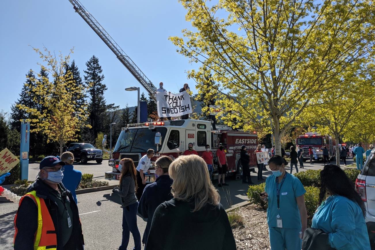 On April 16, first responders from the Eastside gathered with fire trucks outside of Swedish Medical Center in Issaquah to cheer on hospital workers as a sign of appreciation for their work during the COVID-19 pandemic. Corey Morris / staff photo