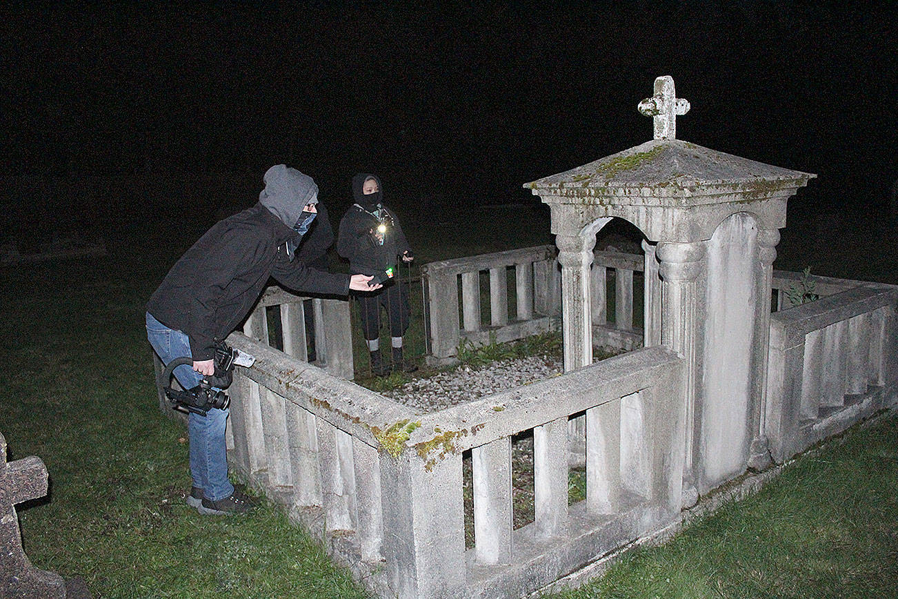The first part of Cascadia Paranormal Investigation's exploration of the Black Diamond Cemetery involved trying to find all the non-paranormal explanations for the phenomenon some people have reported at the site before sitting down with their arsenal of electronics to find any evidence of ghosts or spirits. Their investigation led founder Kyle Richmond to the resting place of Dr. Howard Botts and his wife, Phrania. Photos by Ray Miller-Still