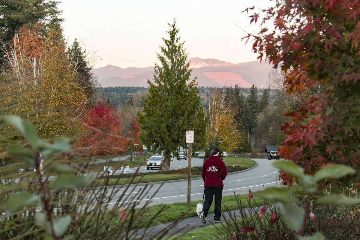 A pedestrian walks along Snoqualmie Parkway in October 2019. File photo