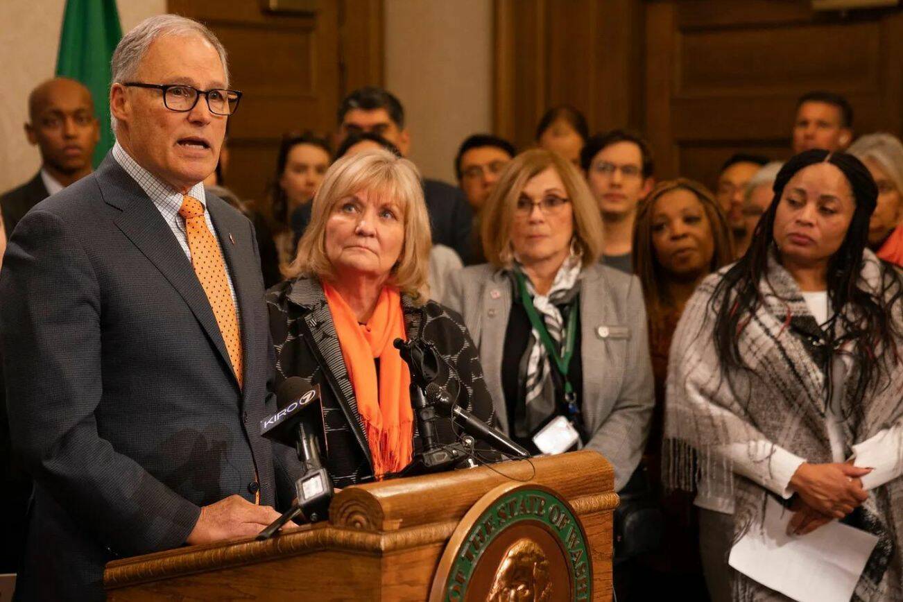 Gov. Jay Inslee, left, with First Lady Trudi Inslee at a press conference advocating for laws to prevent gun violence. (Provided by the Washington State Governors’ Office)