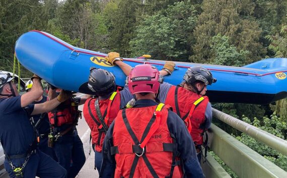 Responders lowered a raft from a 200-foot bridge over the Green River Gorge to help rescue the missing kayakers. Photo courtesy of Puget Sound Fire.