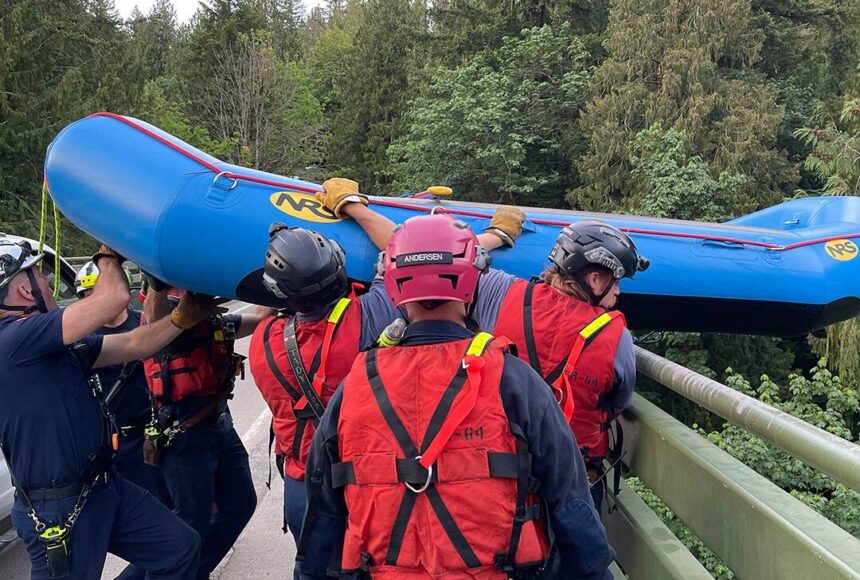 <p>Responders lowered a raft from a 200-foot bridge over the Green River Gorge to help rescue the missing kayakers. Photo courtesy of Puget Sound Fire.</p>