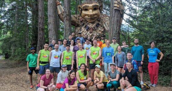 Runners celebrate their 100th run with Jakob Two Trees. (Photo courtesy of Kelly Jiang)