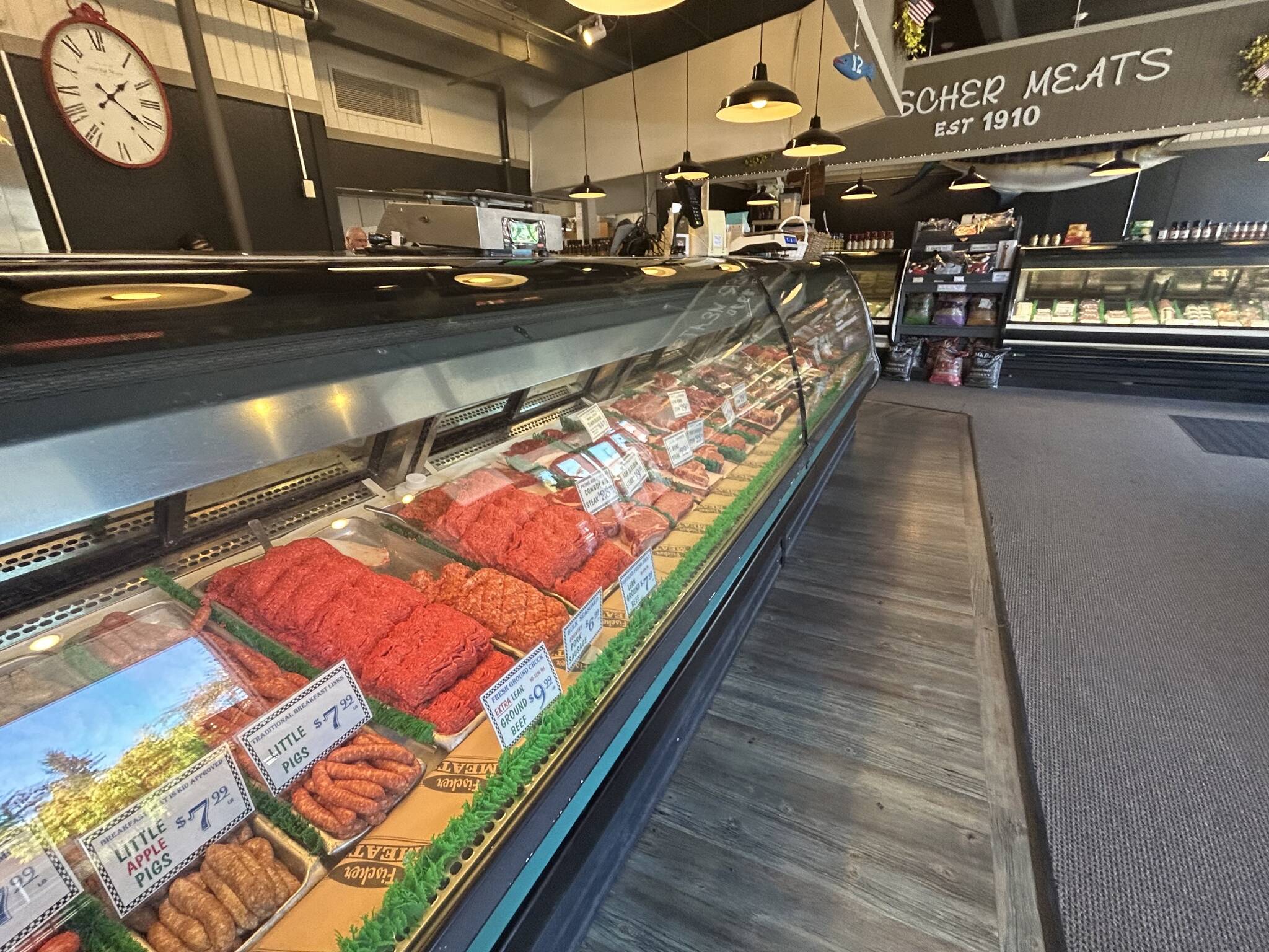 Locally grown beef, chicken, pork, lamb and veal fill the glass cases at Fisher Meats in Issaquah. (Photo by Cameron Sires)