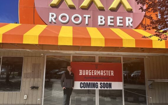 Alex Jensen, CEO and owner of Burgermaster, stands next to the prospective sixth Burgermaster location. (Photo by Cameron Sires/Sound Publishing)