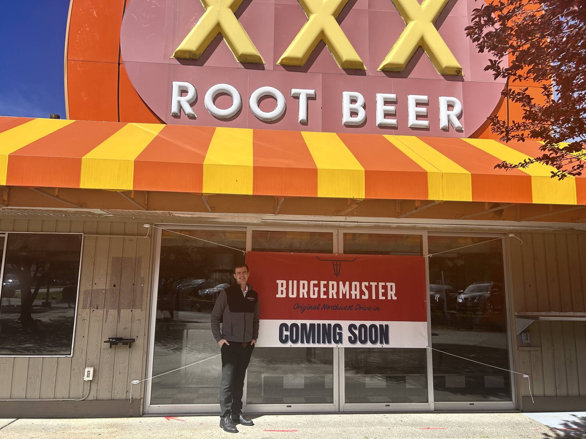 Alex Jensen, CEO and owner of Burgermaster, stands next to the prospective sixth Burgermaster location. (Photo by Cameron Sires/Sound Publishing)