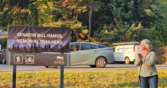 King County Councilmember Sarah Perry unveils the new Issaquah trailhead marker named after her late husband Sen. Bill Ramos, Oct. 6, 2025. Photo courtesy of Sarah Perry