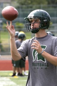 Skyline junior quarterback Jake Heaps takes a break between passing drills.