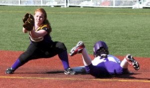 Issaquah's Amanda Marques attempts to lay a tag on Lake Washington's Elsa Moyer Friday afternoon in the KingCo 4A tournament.
