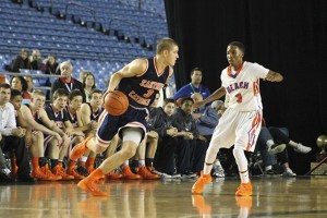 Eastside Catholic's Nathan Christie drives against Rainier Beach guard Naim Ladd during the 3A state title game.