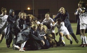 Skyline players swarm Michelle Bretl after she scored the game-winning penalty kick Saturday