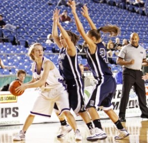 Issaquah's Blaire Brady is swarmed by Auburn Riverside defenders Makenna Clark and Nichole Jackson. The Ravens forced the Eagles into nine fourth-quarter turnovers to come from behind and win.