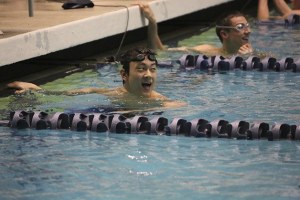 Kim takes a glance at the scoreboard after a state title swim.