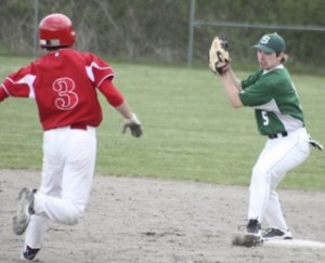 Skyline's Ryan Gilchrist gets set to lay a tag on Newport's Trace Tam Sing Monday afternoon when he tried to stretch a single into a double.
