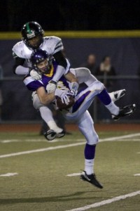 Brennan Miller fights for the ball against Kentwood's Darrius Coleman.