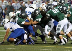 Skyline Spartans defenders swarm a Graham-Kapowsin Eagles ball carrier. Graham-Kapowsin defeated Skyline 17-14 in a non-league game on Oct. 10 in Sammamish.
