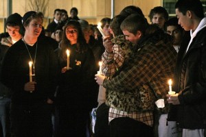 An Issaquah lacrosse player embraces the mother of Tyler Lucas