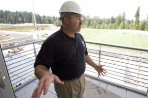 Eastside Catholic athletic director Lance Gatter looks over his athletic facilities in Aug. 2008 — a month before the new campus opened in Sammamish.