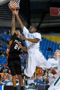 Skyline's Kasen Williams drives in for two points against Davis guard David Trimble. Williams had 19 points in Skyline's 55-44 win Thursday morning.