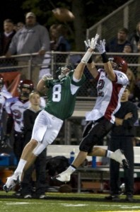 Skyline defender Will Chandler goes up to knock a pass away from Eastlake wide receiver Jeff Grotjahn. The Spartans' defense earned its fourth shutout of the season