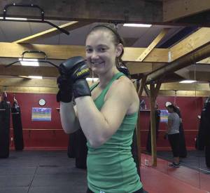 Missy Lee stands near the heavy bags in her Issaquah gym