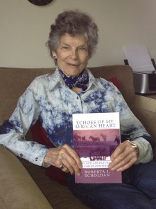 Roberts Scholdan holds her book 'Echoes of my African Heart